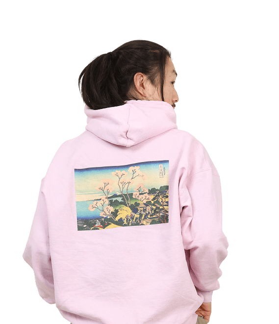 Person wearing pink hoodie with Japanese ukiyo-e print